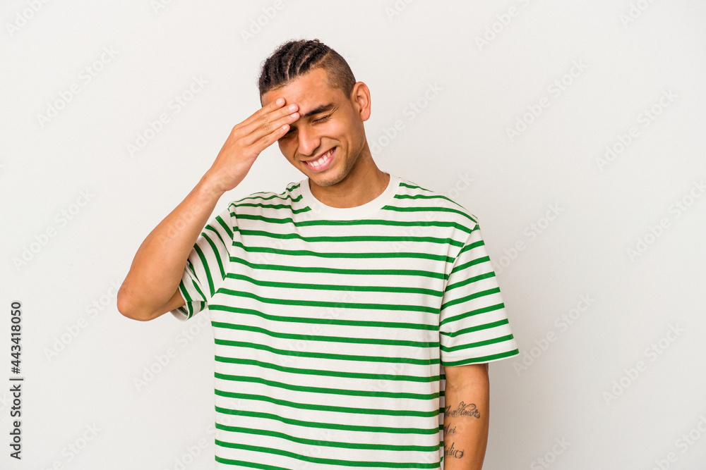 Young venezuelan man isolated on white background blink at the camera through fingers, embarrassed covering face. Young venezuelan man isolated on white background blink at the camera through fingers, embarrassed covering face.