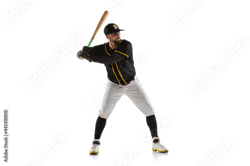 Canvas Print Baseball player, pitcher in a black white sports uniform practicing isolated on a white studio background