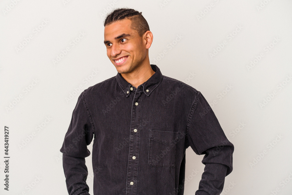 Young venezuelan man isolated on white background dreaming of achieving goals and purposes Young venezuelan man isolated on white background dreaming of achieving goals and purposes