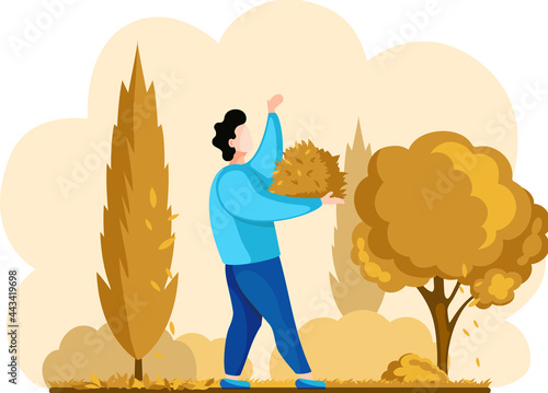 Man gardener worker collects fallen leaves from trees from ground, works on farm. Agricultural worker in autumn tidies up garden, removes fallen yellow leaves stands near trees and bushes in yard