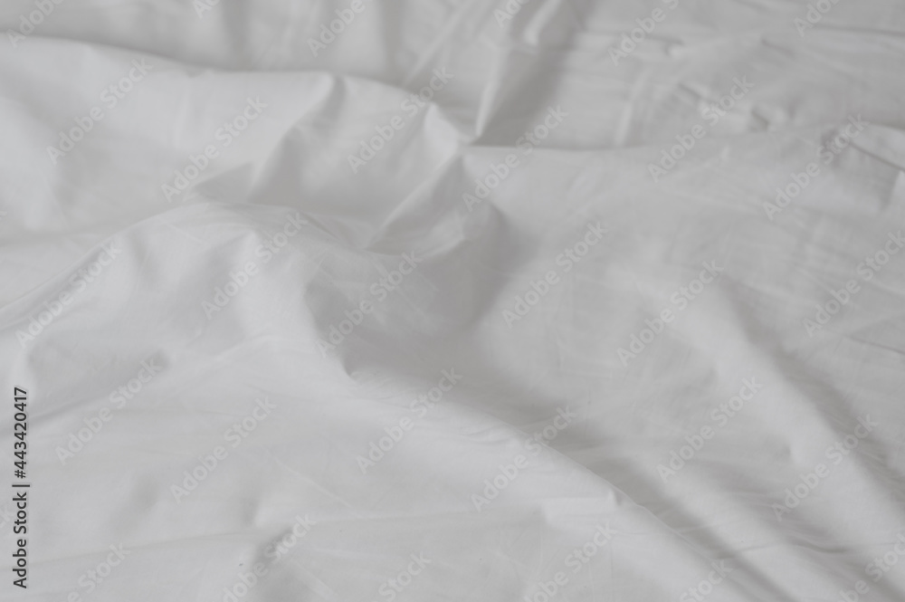 white crumpled sheet with folds close up