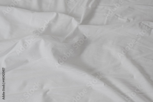 white crumpled sheet with folds close up