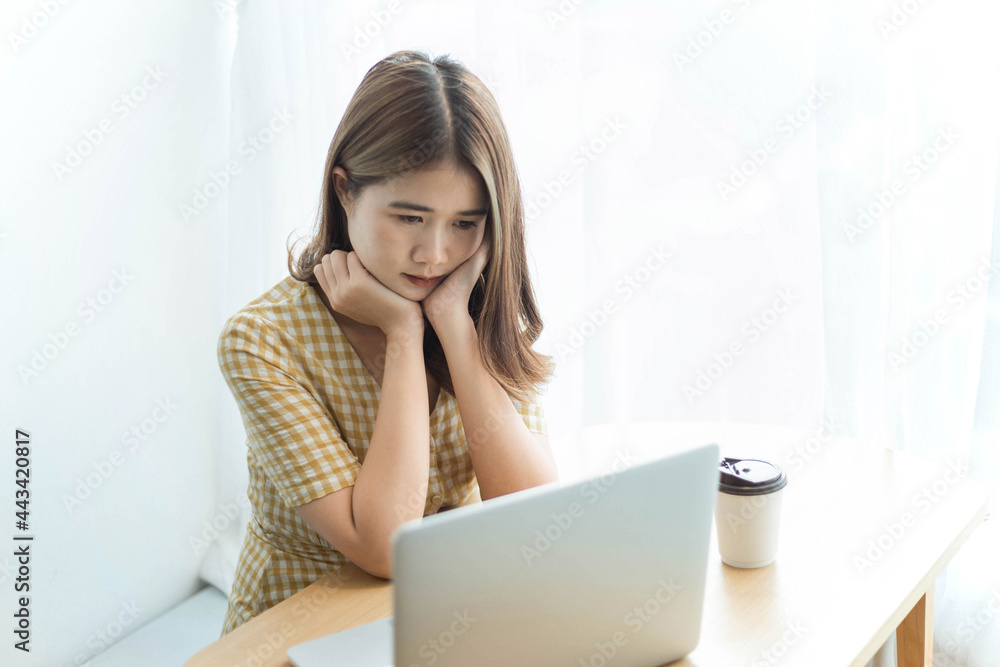 Entrepreneur concept a young female freelancer enjoying break time with social media on the device Entrepreneur concept a young female freelancer enjoying break time with social media on the device