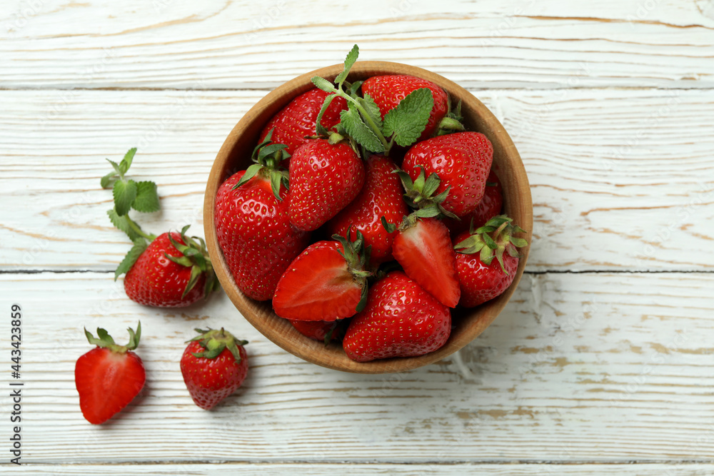 Bowl of strawberry on white wooden background Bowl of strawberry on white wooden background