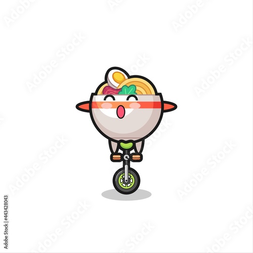 The cute noodle bowl character is riding a circus bike © heriyusuf
