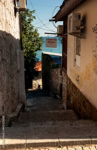 The street of the seaside town. The inscription on the sign – 