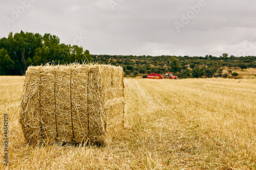 Tractor and haystack on field photo