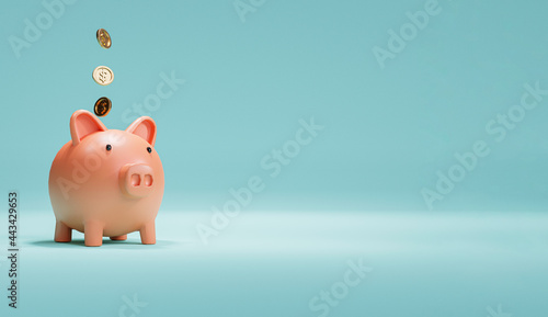 Fotografija Pink piggy bank and US dollar coins falling on blue background for money saving and deposit concept , creative ideas by 3D rendering technique