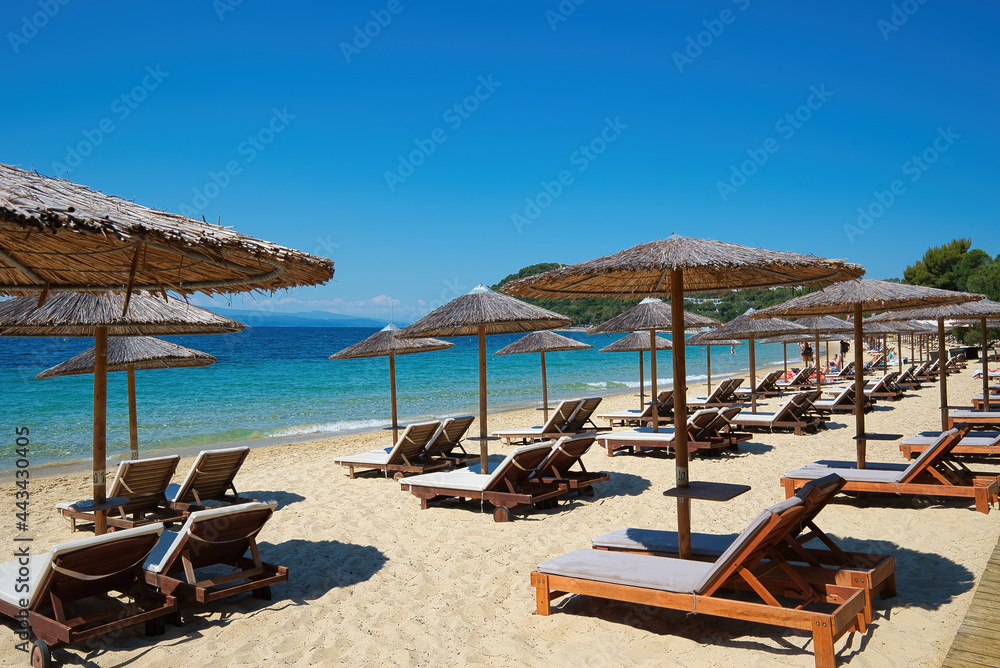 Koukounaries , the world-famous beach of the island of Skiathos in Greece, combines the green of the pine, the blonde sand and the crystal clear sea.