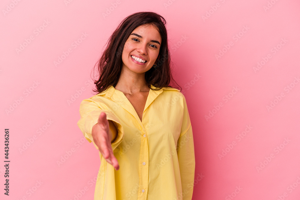 Young caucasian woman isolated on pink background smiling and raising thumb up Young caucasian woman isolated on pink background smiling and raising thumb up