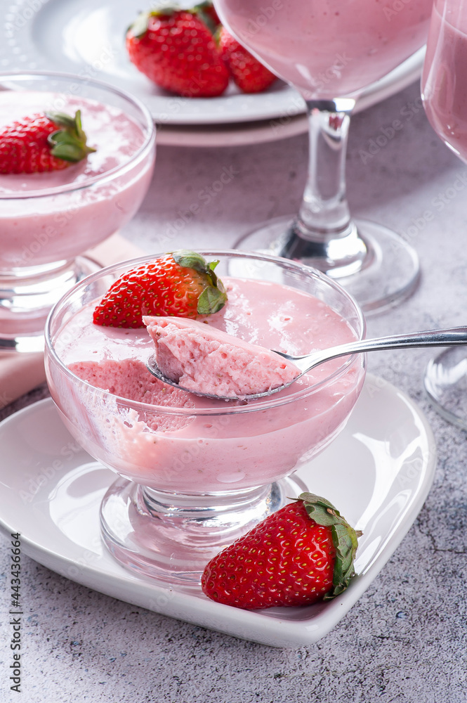 Delicious strawberry mousse in glass bowl with fresh strawberries. Delicious strawberry mousse in glass bowl with fresh strawberries.