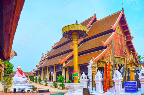 The chatra umbrella in front of Viharn Luang of Wat Phra That Lampang Luang Temple, Lampang, Thailand photo