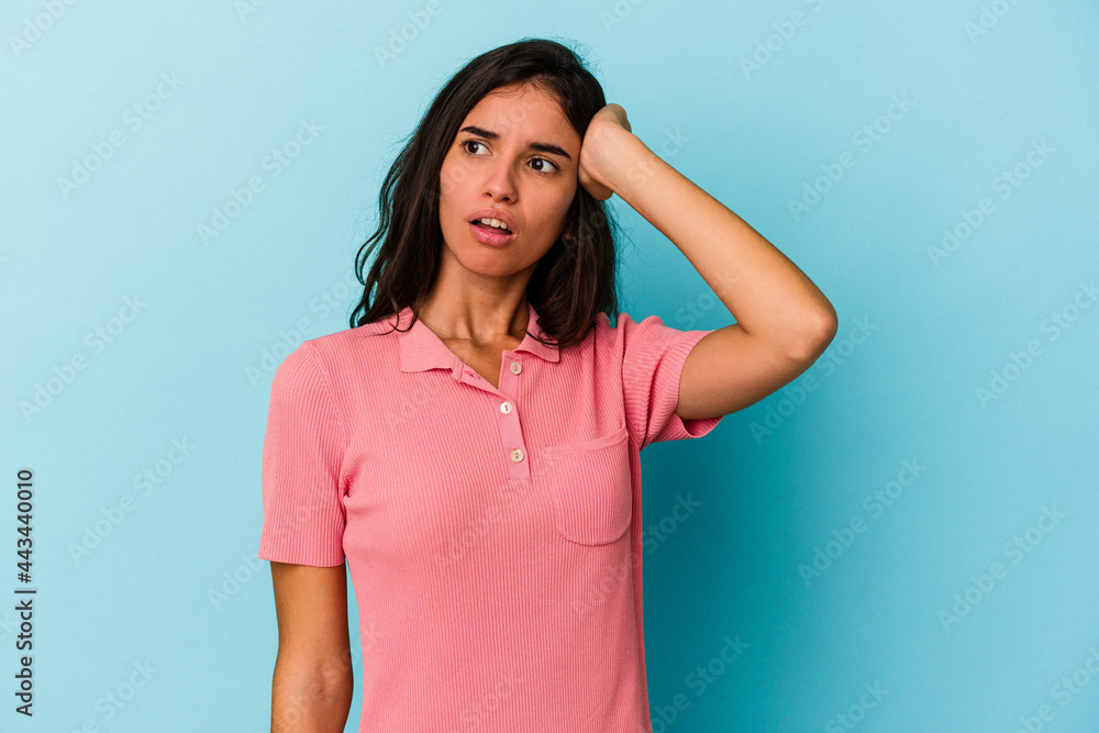 Young caucasian woman isolated on blue background being shocked, she has remembered important meeting. Young caucasian woman isolated on blue background being shocked, she has remembered important meeting.