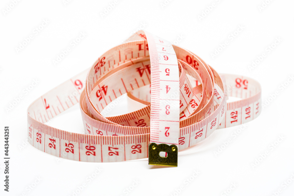 White measuring tape isolated on white background. With Clipping path. White measuring tape isolated on white background. With Clipping path.
