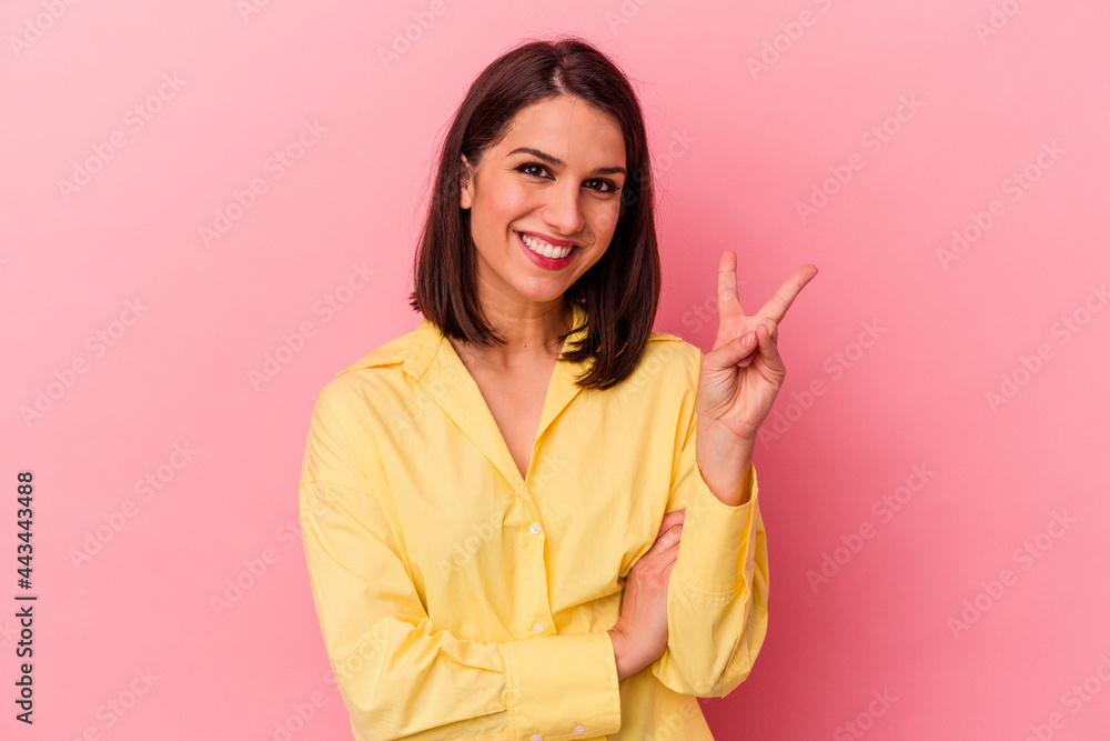 Young caucasian woman isolated on pink background showing number two with fingers. Young caucasian woman isolated on pink background showing number two with fingers.