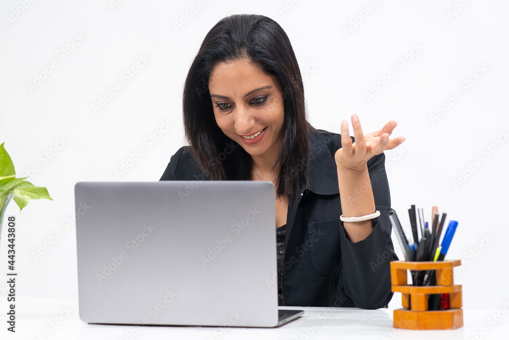 Portrait of professional Indian businesswoman working from her computer, Freelancer, work from home, Smiling corporate lady. Portrait of professional Indian businesswoman working from her computer, Freelancer, work from home, Smiling corporate lady.