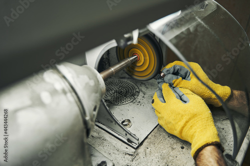 Male grinding ring on an abrasive wheel grinder photo