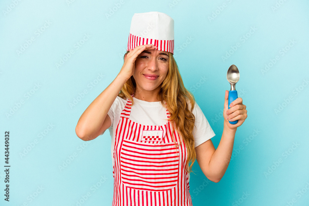 Caucasian ice cream maker woman holding an ice cream scoop isolated on blue background being shocked, she has remembered important meeting. Caucasian ice cream maker woman holding an ice cream scoop isolated on blue background being shocked, she has remembered important meeting.