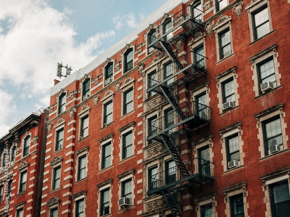 A building with fire escapes in the East Village, New York City