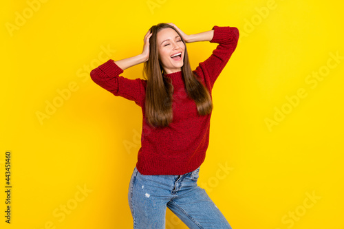Photo of young excited woman happy positive smile dream hands touch head isolated over yellow color background