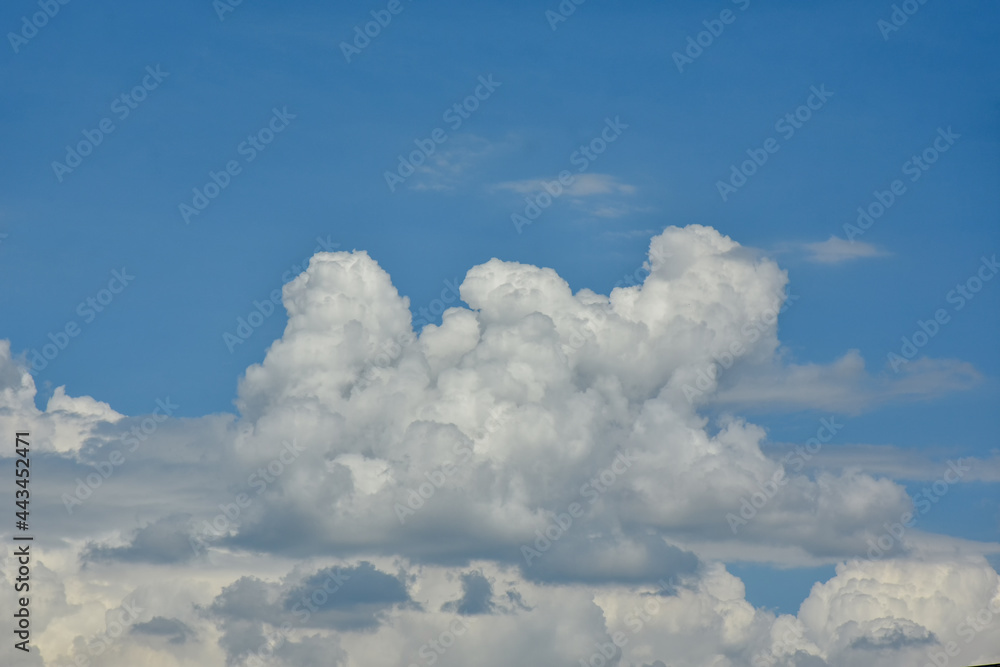 Beautiful cumulus clouds against the blue daytime sky. Beautiful cumulus clouds against the blue daytime sky.