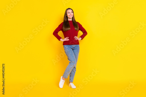 Full length photo of young attractive woman happy positive smile confident look empty space isolated over yellow color background