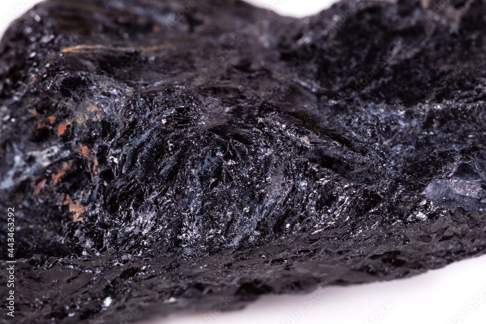 Macro mineral stone sorrel - black tourmaline on white background Macro mineral stone sorrel - black tourmaline on white background