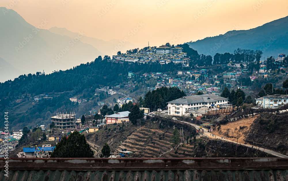 tawang city view with orange sky from hill top at evening