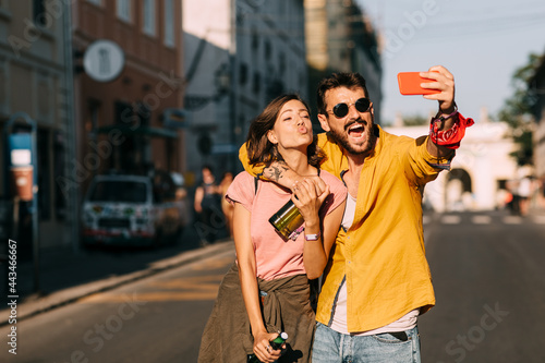 Young couple making selfie on the street
