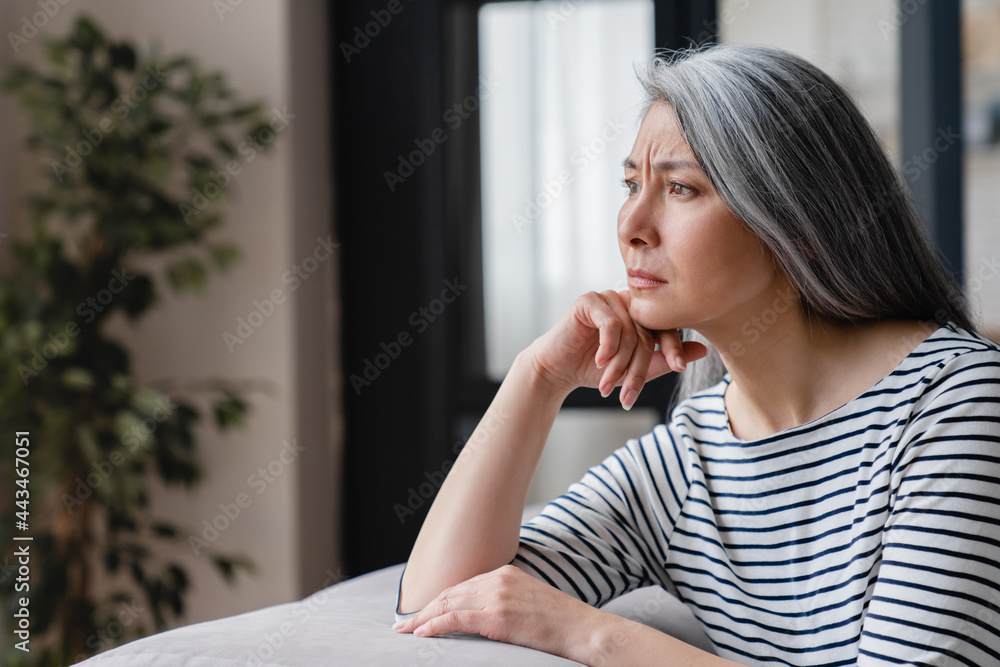 Close up portrait of a sad depressed tired lonely divorced ill mother mature woman feeling unwell, unhealthy, suffering from midlife crisis on lockdown. Close up portrait of a sad depressed tired lonely divorced ill mother mature woman feeling unwell, unhealthy, suffering from midlife crisis on lockdown.