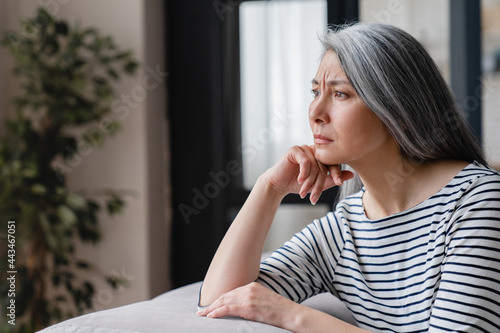 Bild auf Leinwand Close up portrait of a sad depressed tired lonely divorced ill mother mature woman feeling unwell, unhealthy, suffering from midlife crisis on lockdown