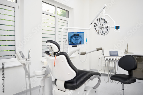 Dentist s office interior with modern chair and special dentisd equipment. The interior of stomatology clinic.