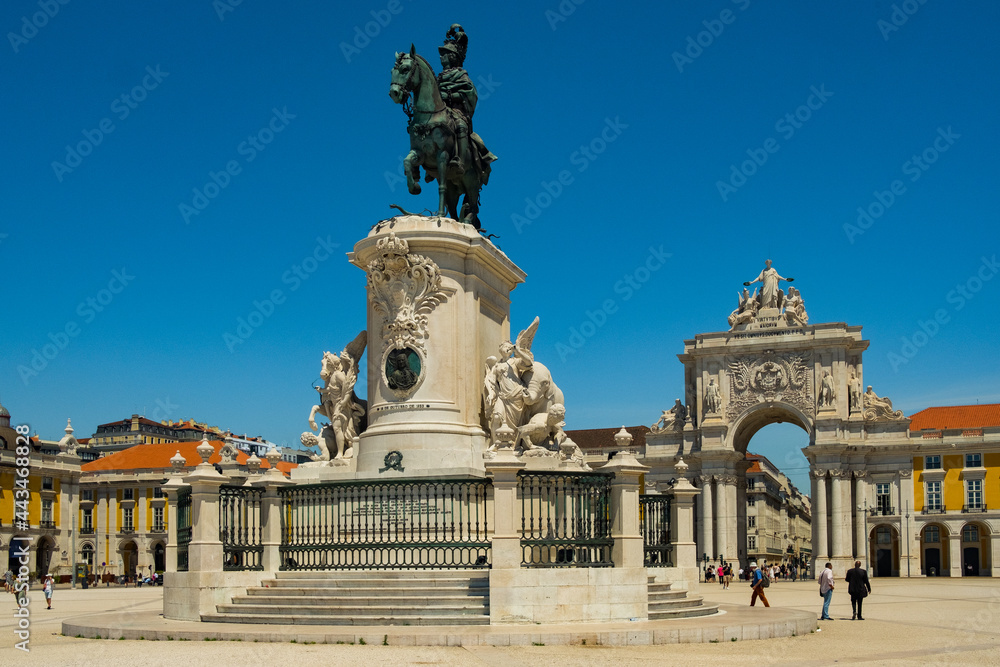 Beautiful image of the gate and landmark statue of King Jose on the Commerce square (Praca do Comercio) in Lisbon, Portugal with blus sky during tourist season