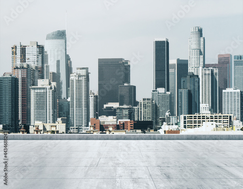 Empty concrete dirty rooftop on the background of a beautiful LA city skyline at morning  mock up