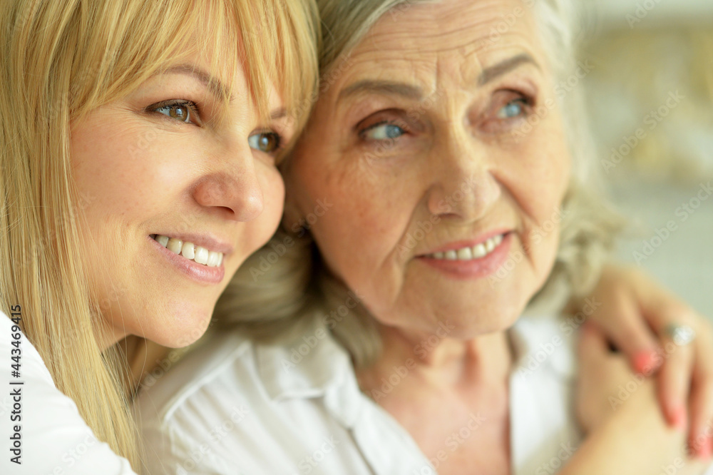 Close up portrait of smiling mother and daughter Close up portrait of smiling mother and daughter