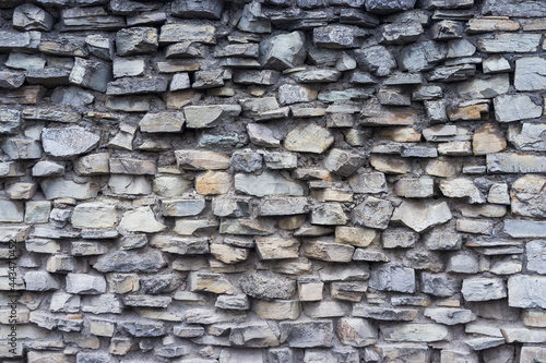 The texture of a stone wall. Old castle stone wall texture background. Stonewall as a background or texture. Part of a stone wall, for background or texture