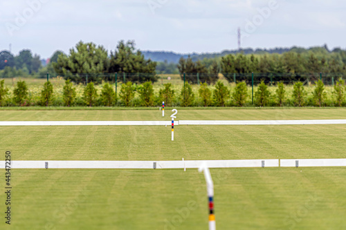 several free fields are prepared for playing croquet, the field is cut with a hoops and signs