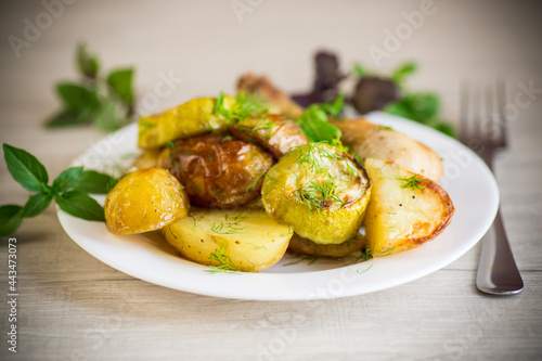 Early baked potatoes with zucchini and chicken