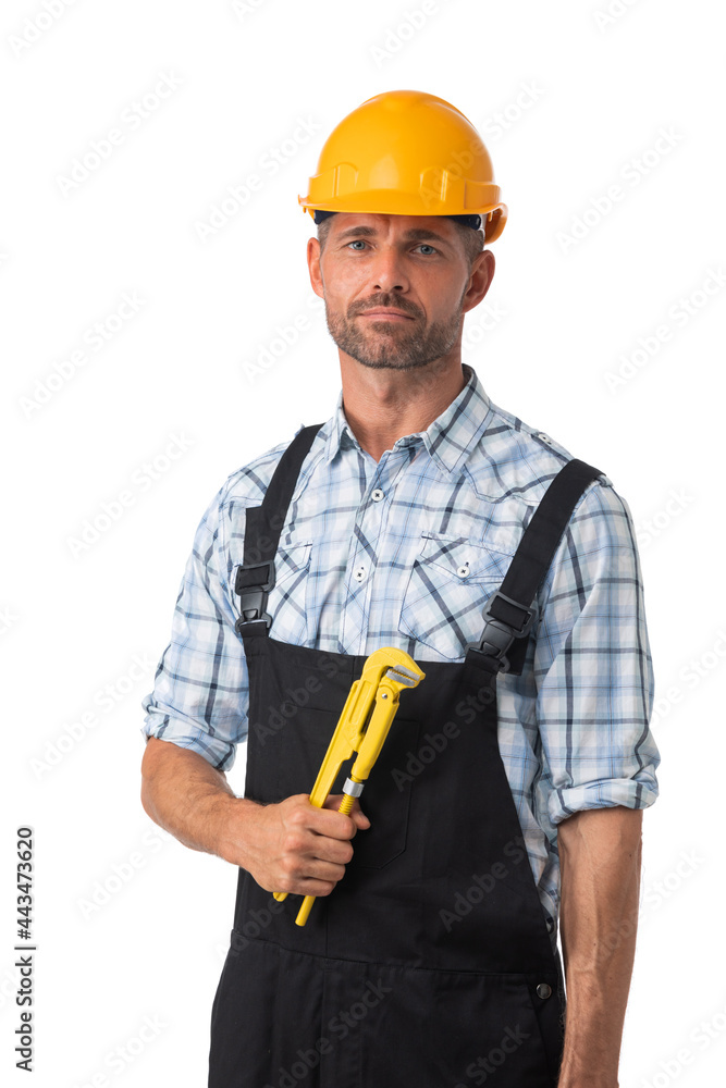Contractor worker holding adjustable spanner Contractor worker holding adjustable spanner