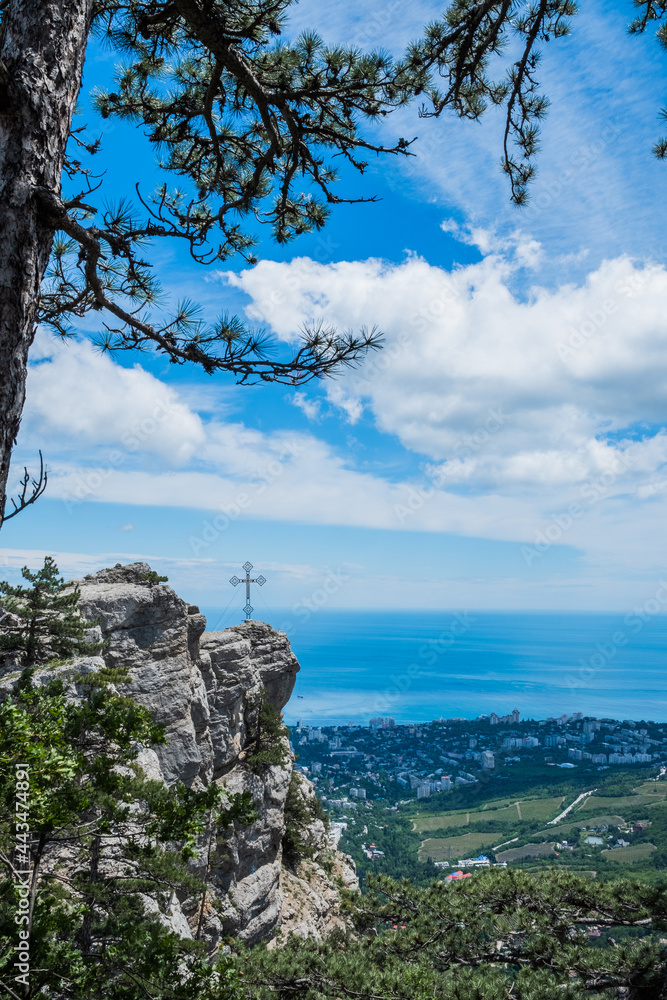 Beautiful pine tree against the backdrop of mountains and blue cloudy sky.Beauty of nature. Pure ecology. Crimea mountains. Beautiful pine tree against the backdrop of mountains and blue cloudy sky.Beauty of nature. Pure ecology. Crimea mountains.