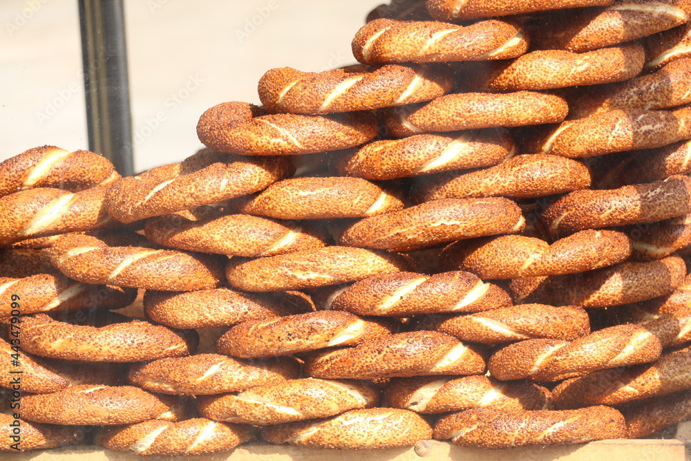 Selective focus street bagels sold as street food in the crowded Eminönü district and a donut known as Açaç Selective focus street bagels sold as street food in the crowded Eminönü district and a donut known as Açaç