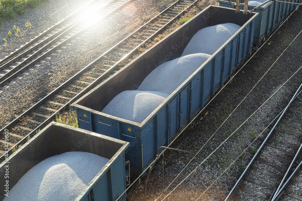 Fototapeta premium Freight train with white gravel, top view