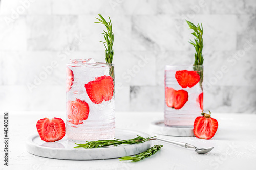Obraz na plátne Two highball collins glasses of refreshing strawberry rosemary sparkling lemonade