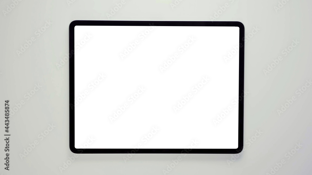 A tablet with black frame and blank white screen, isolated modern real tab computer 3D with copy space mockup. A tablet with black frame and blank white screen, isolated modern real tab computer 3D with copy space mockup.