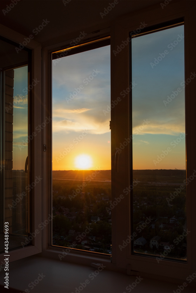 Sunset view from the window of a high-rise building on the outskirts of a megalopolis in Russia. Sunset view from the window of a high-rise building on the outskirts of a megalopolis in Russia.