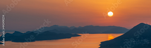 orange sunset. islands with mountain peaks. Adriatic sea. Dubrovnik  Croatia.