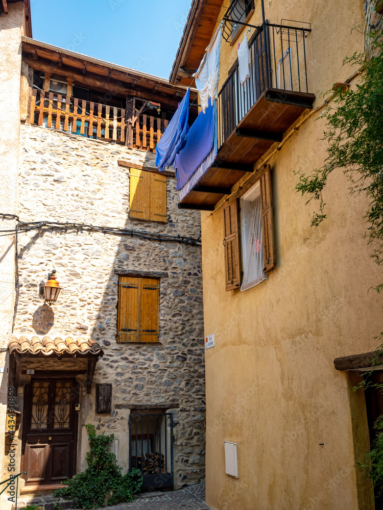 classic mountain village houses in small French Alps village Saint Sauveur sur Tinee