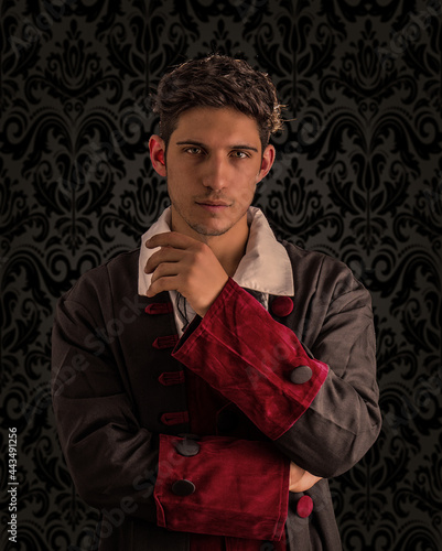 Young man in old fashioned garment in studio shot