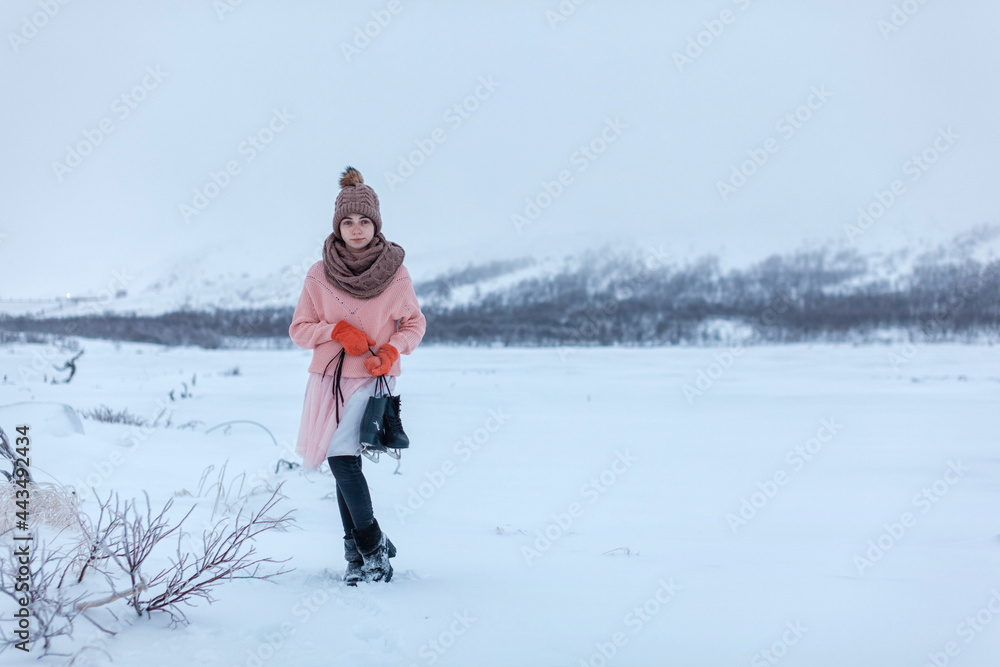 beautiful happy girl hat, skirt jacket stands winter people with black skates hands. concept healthy lifestyle, sports