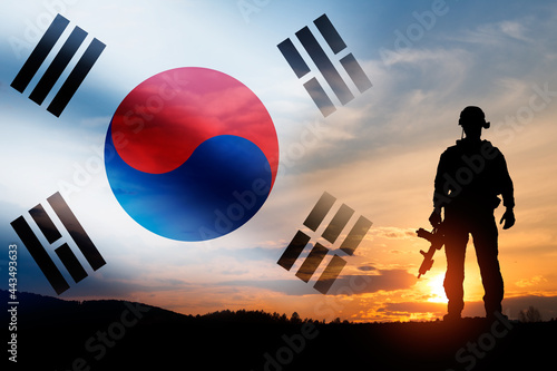 Silhouette of a soldiers against the sunrise. Concept - protection, patriotism. Armed forces of South Korea. photo